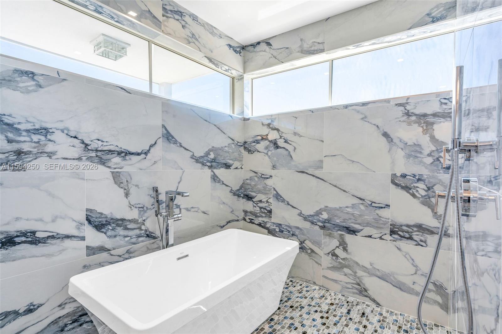 84 Coral Way Key Largo, FL 33037 - Photo 35 of 55 a bathroom with a bathtub and shower