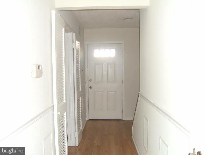 14507 Golden Oak Road Centreville, VA 20121 - Photo 5 of 12 a view of a hallway with wooden floor