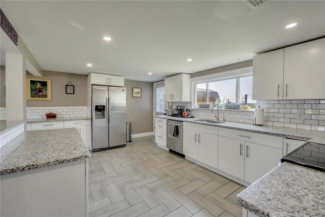 439 Cherry Hill Road Nazareth, PA 18064 - Photo 5 of 31 A chef's delight, this kitchen showcases sleek stainless steel appliances and abundant counter space.