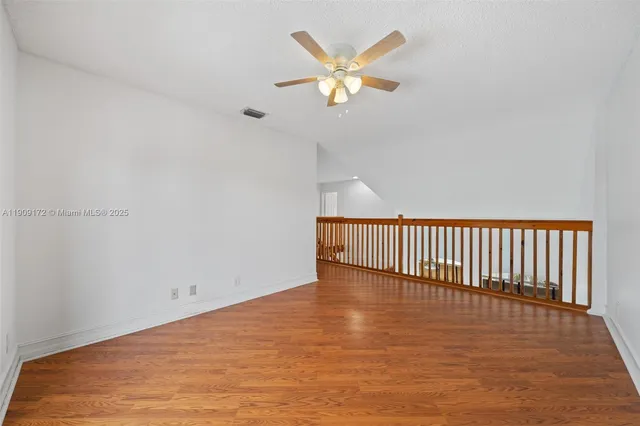 a bathroom with a tub sink double vanity and a mirror