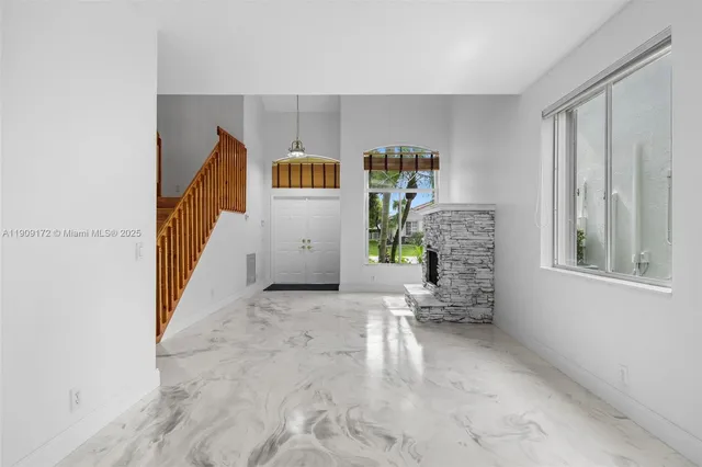 a view of workspace with furniture and window