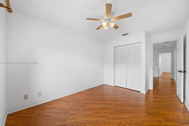 front view of a house with a yard table and chairs