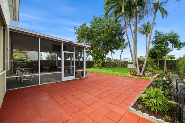 an aerial view of a house with a lake view