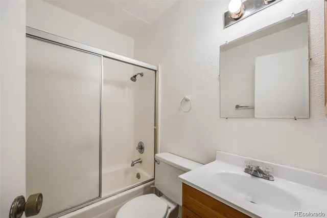 a view of hallway with wooden floor