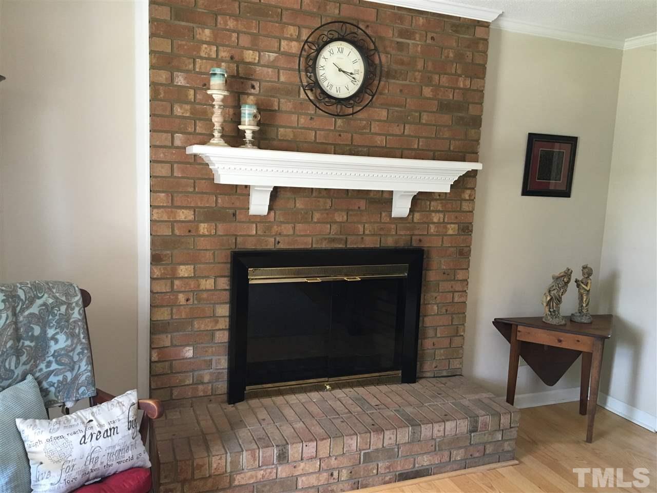 10101 Joe Leach Road Raleigh, NC 27603 - Photo 11 of 15 a living room with furniture and a fireplace