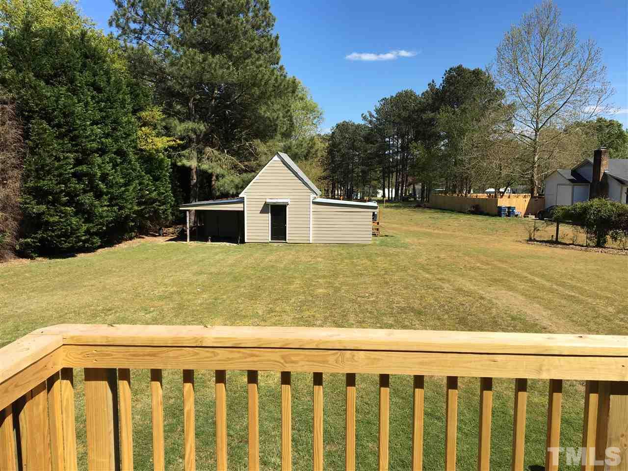 10101 Joe Leach Road Raleigh, NC 27603 - Photo 12 of 15 a view of a yard with wooden fence
