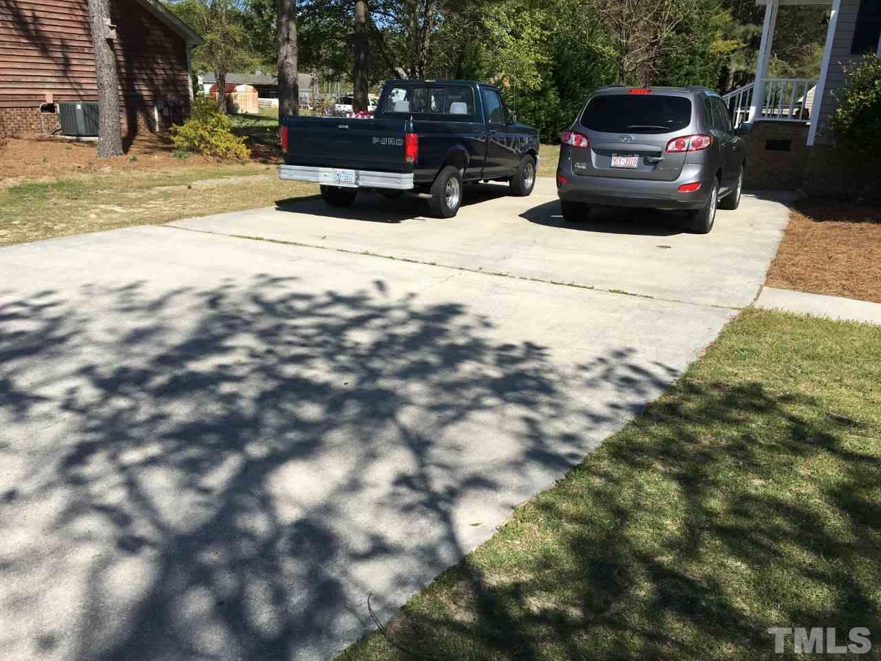 10101 Joe Leach Road Raleigh, NC 27603 - Photo 4 of 15 a view of street with parked cars