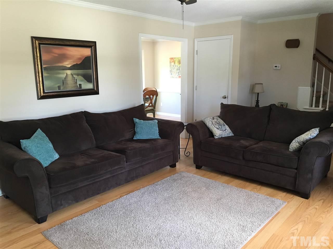 10101 Joe Leach Road Raleigh, NC 27603 - Photo 7 of 15 a living room with furniture and a couch