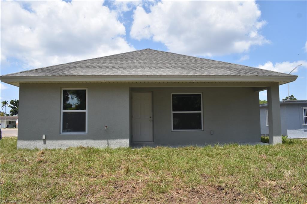 3880 Lora Street Fort Myers, FL 33916 - Photo 6 of 6 a house with yard