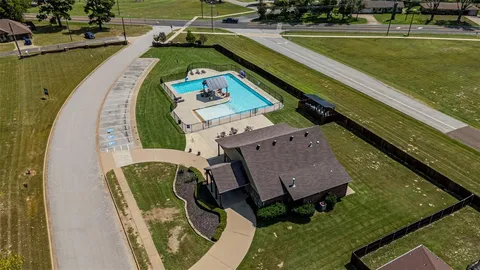swimming pool view with a outdoor seating