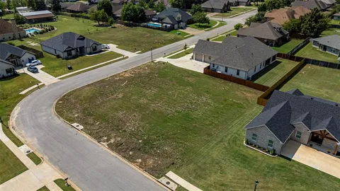 a view of a pool in a backyard