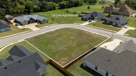 an aerial view of a house with a swimming pool