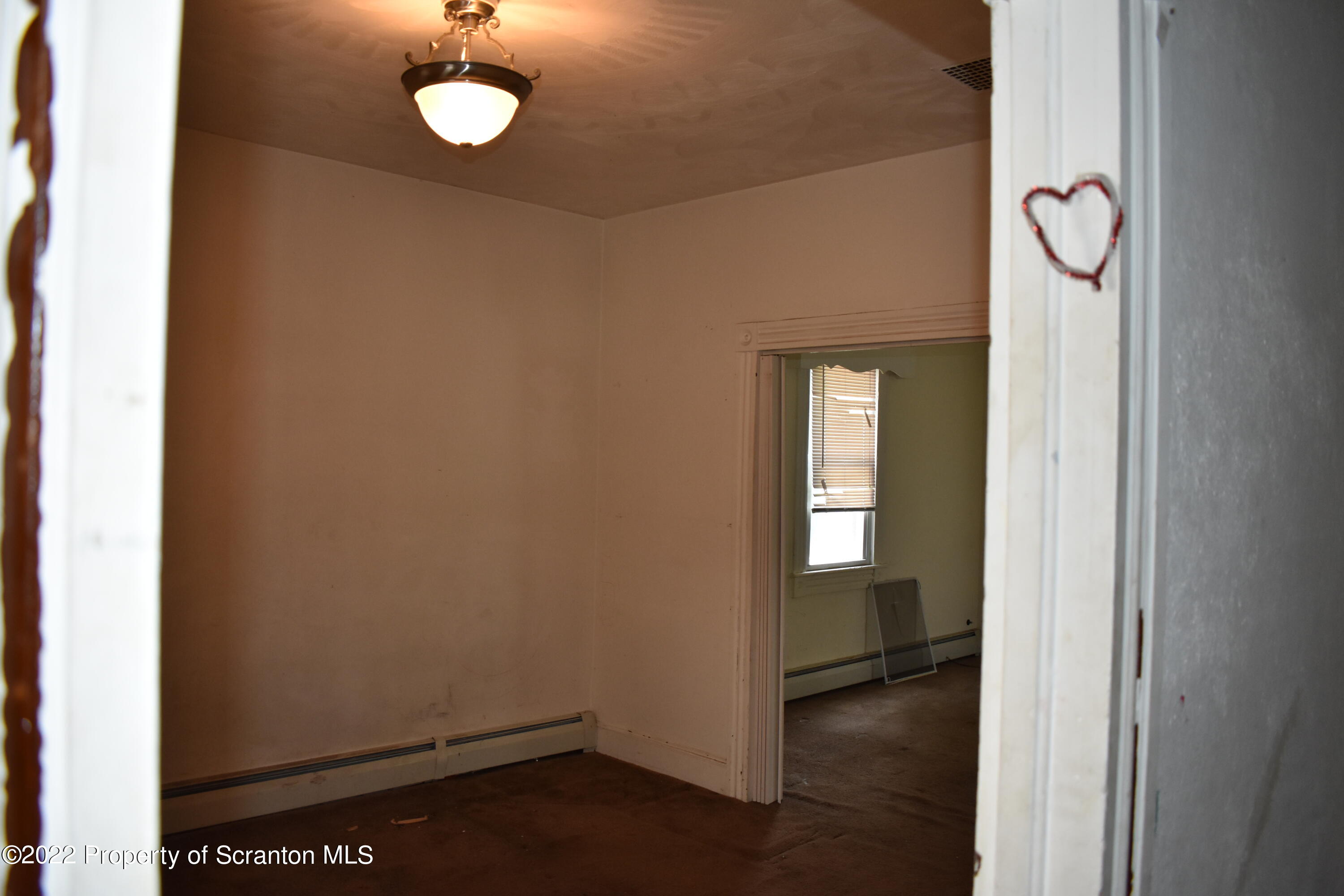 315 Aswell Court Scranton, PA 18504 - Photo 3 of 15 an empty room with wooden floor and closet