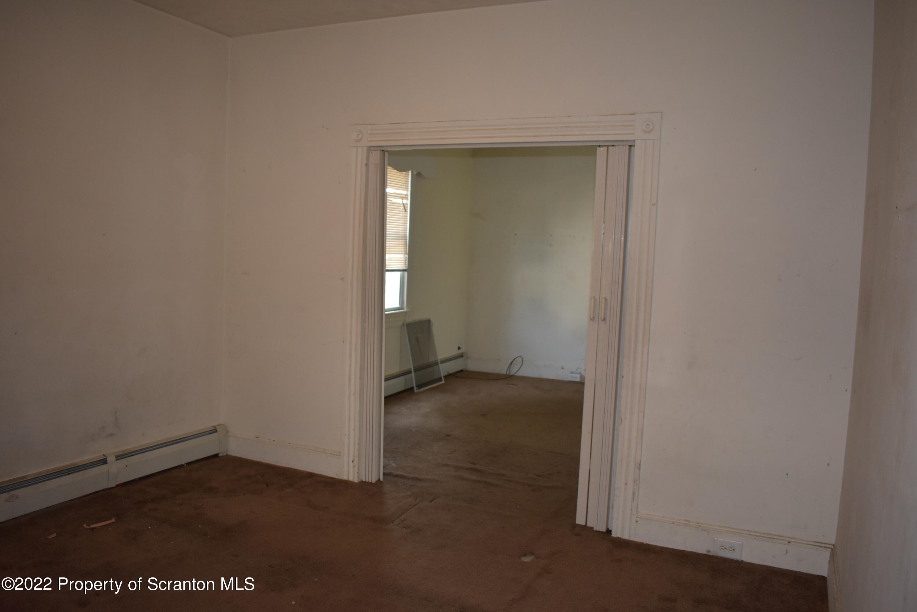 315 Aswell Court Scranton, PA 18504 - Photo 4 of 15 an empty room with a door
