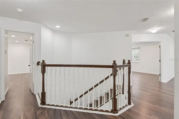 a view of entryway with wooden floor