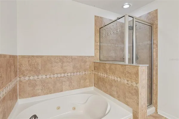 a bathroom with a bathtub and a shower