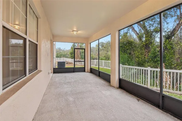 a view of a big room with windows