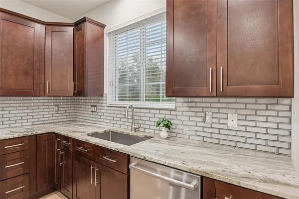 a kitchen with a sink and cabinets