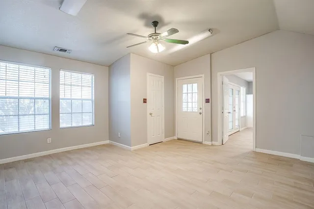 a view of an empty room with a window
