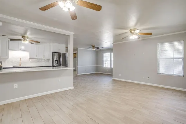 a view of a kitchen with marble kitchen and stainless steel appliances
