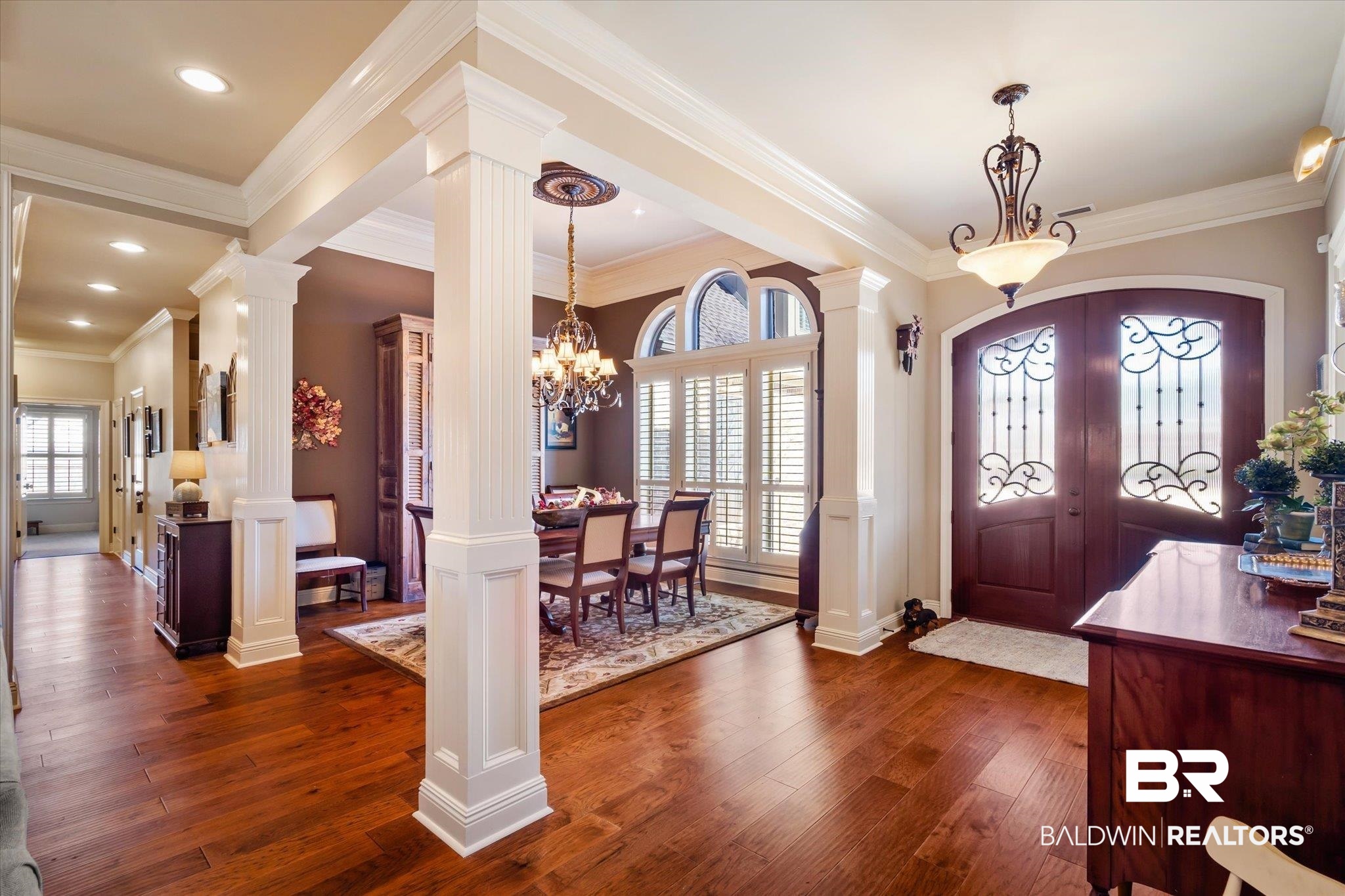 5683 Spring Landing Drive Theodore, AL 36582 - Photo 3 of 49 Foyer featuring a healthy amount of sunlight, decorative columns, and dark wood-type flooring