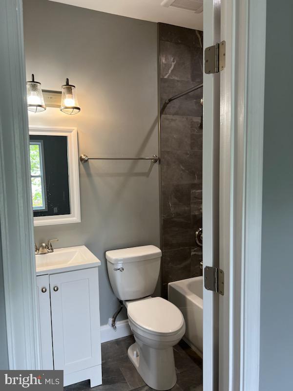 1706 Massachusetts Avenue Southeast, Unit A Washington, DC 20003 - Photo 5 of 9 a bathroom with a toilet sink and shower