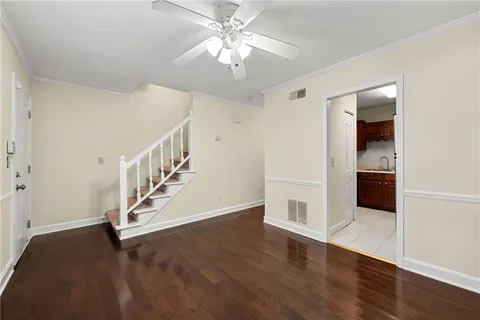 a view of an entryway with wooden floor