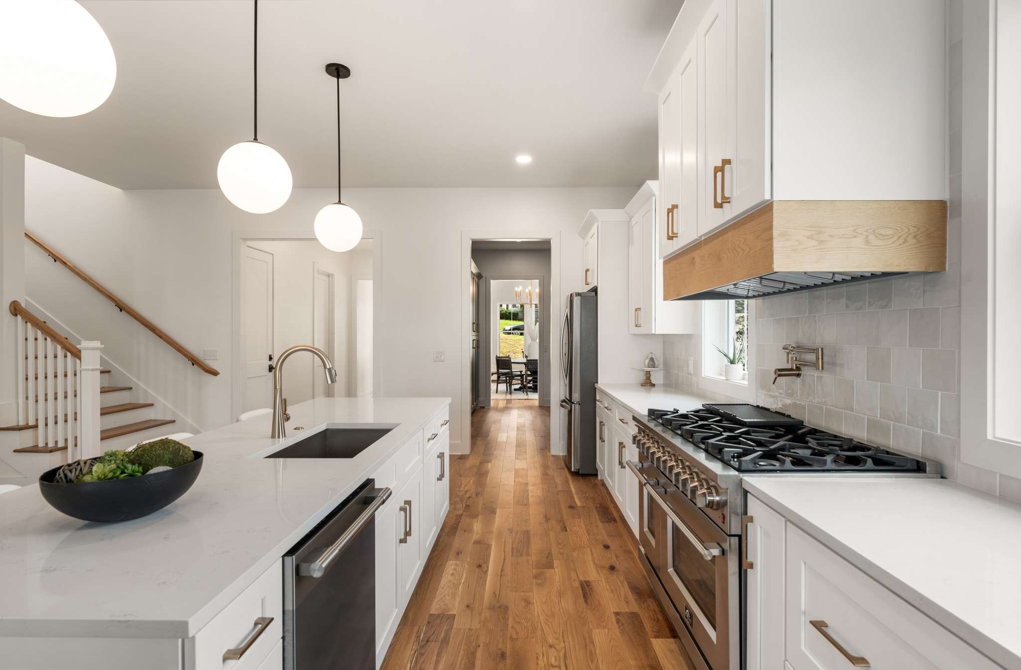 3512 Elkins Avenue Nashville, TN 37209 - Photo 13 of 36 a kitchen with kitchen island stainless steel appliances a stove and a wooden floor