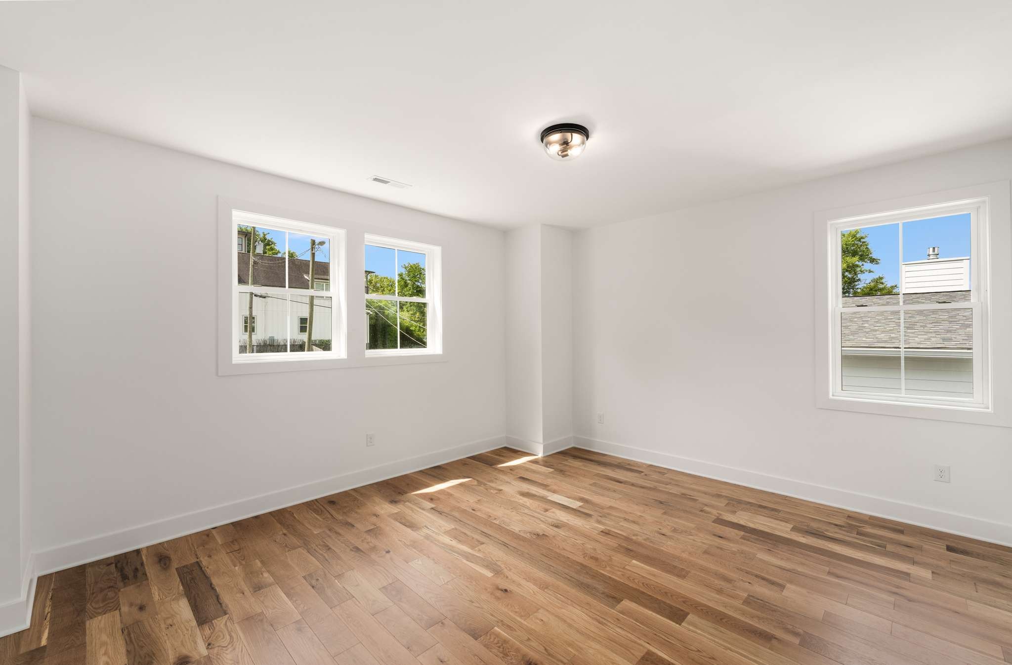 3512 Elkins Avenue Nashville, TN 37209 - Photo 27 of 36 a view of empty room with window and wooden floor