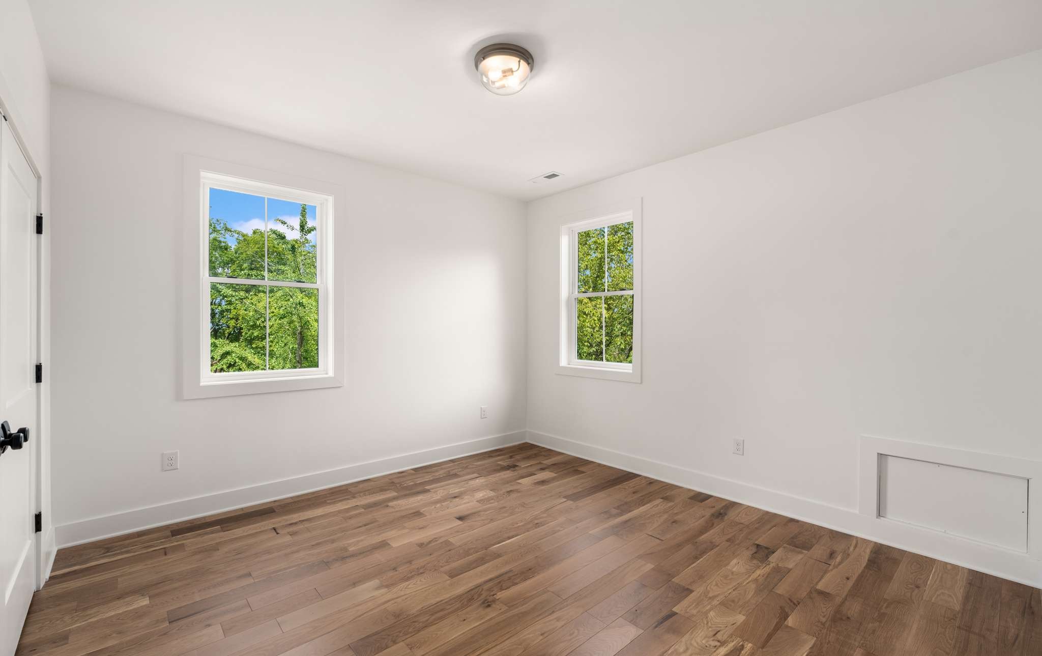 3512 Elkins Avenue Nashville, TN 37209 - Photo 30 of 36 an empty room with wooden floor and windows