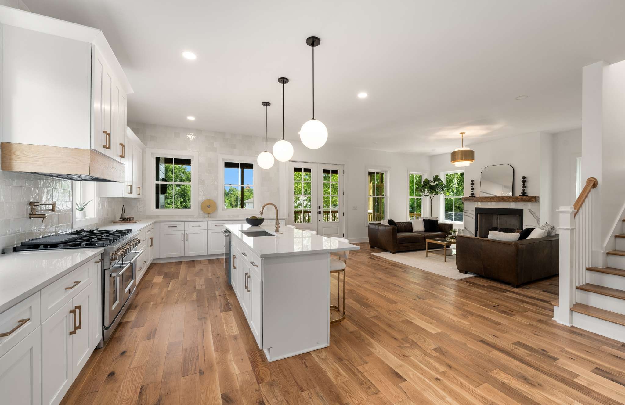 3512 Elkins Avenue Nashville, TN 37209 - Photo 6 of 36 a large kitchen with cabinets a counter top space a sink a stove and wooden floor