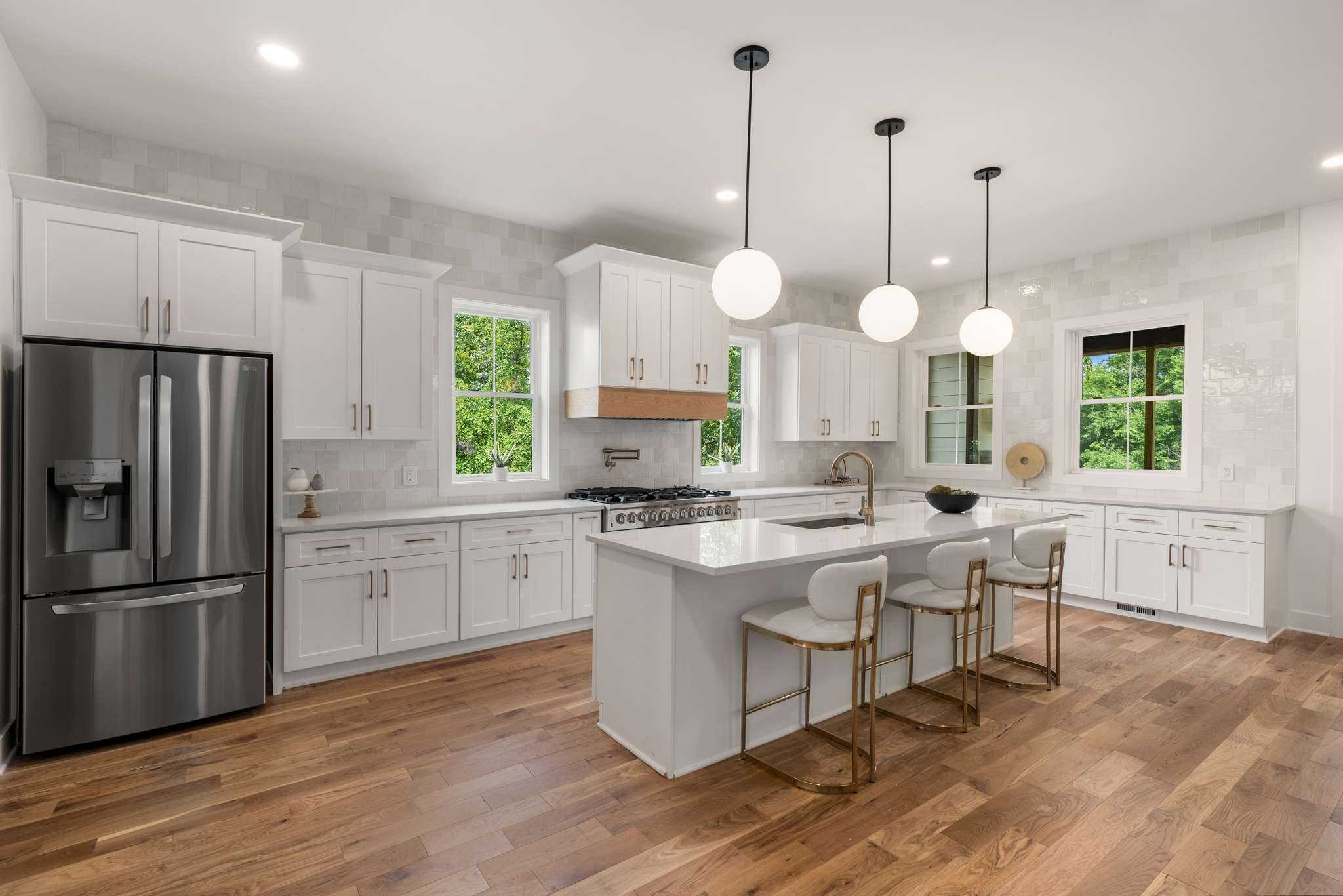 3512 Elkins Avenue Nashville, TN 37209 - Photo 7 of 36 a kitchen with kitchen island granite countertop a stove a sink a center island and a wooden floor