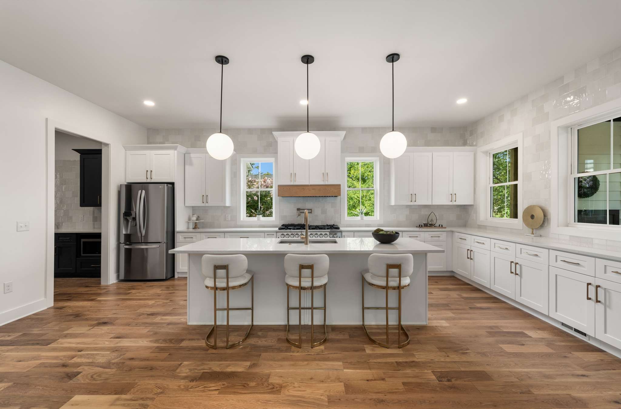 3512 Elkins Avenue Nashville, TN 37209 - Photo 9 of 36 a large kitchen with kitchen island granite countertop a stove a sink a center island a refrigerator and a view of living room