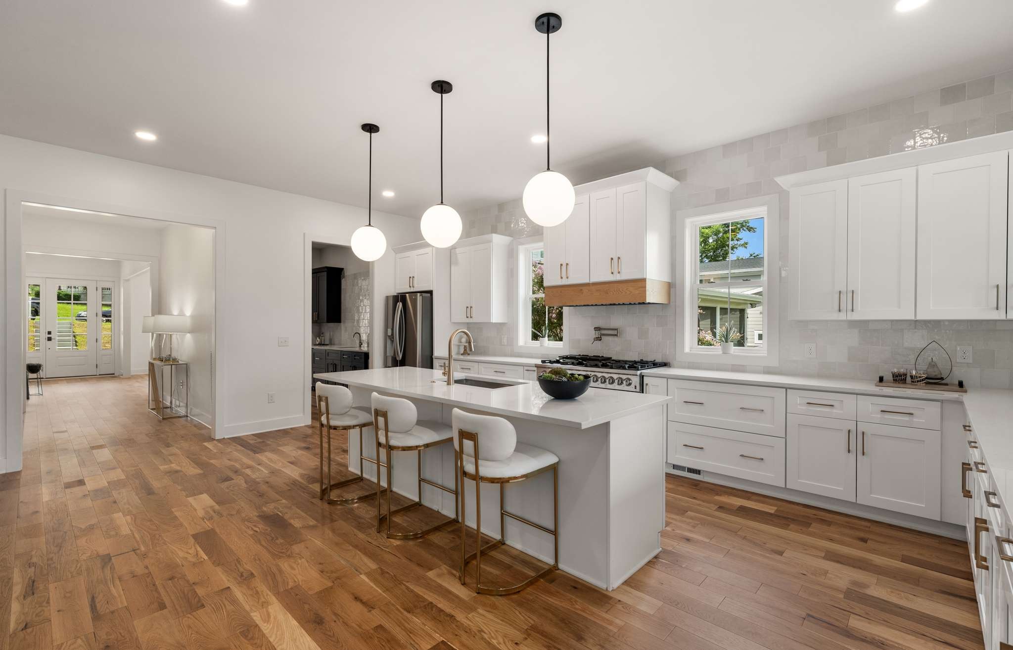 3512 Elkins Avenue Nashville, TN 37209 - Photo 10 of 36 a open kitchen with stainless steel appliances granite countertop a stove a sink and a wooden floors