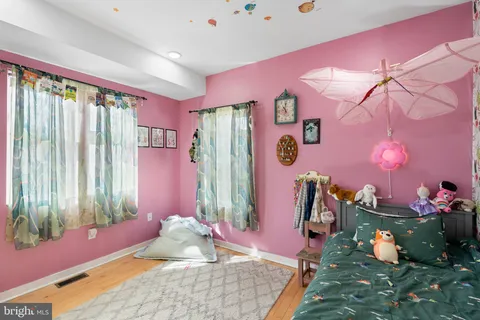 a bed room with a bed and a window
