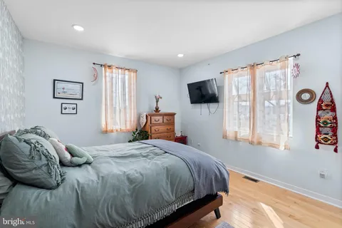a bedroom with bed and window