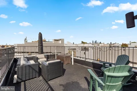 a view of a roof deck with couches