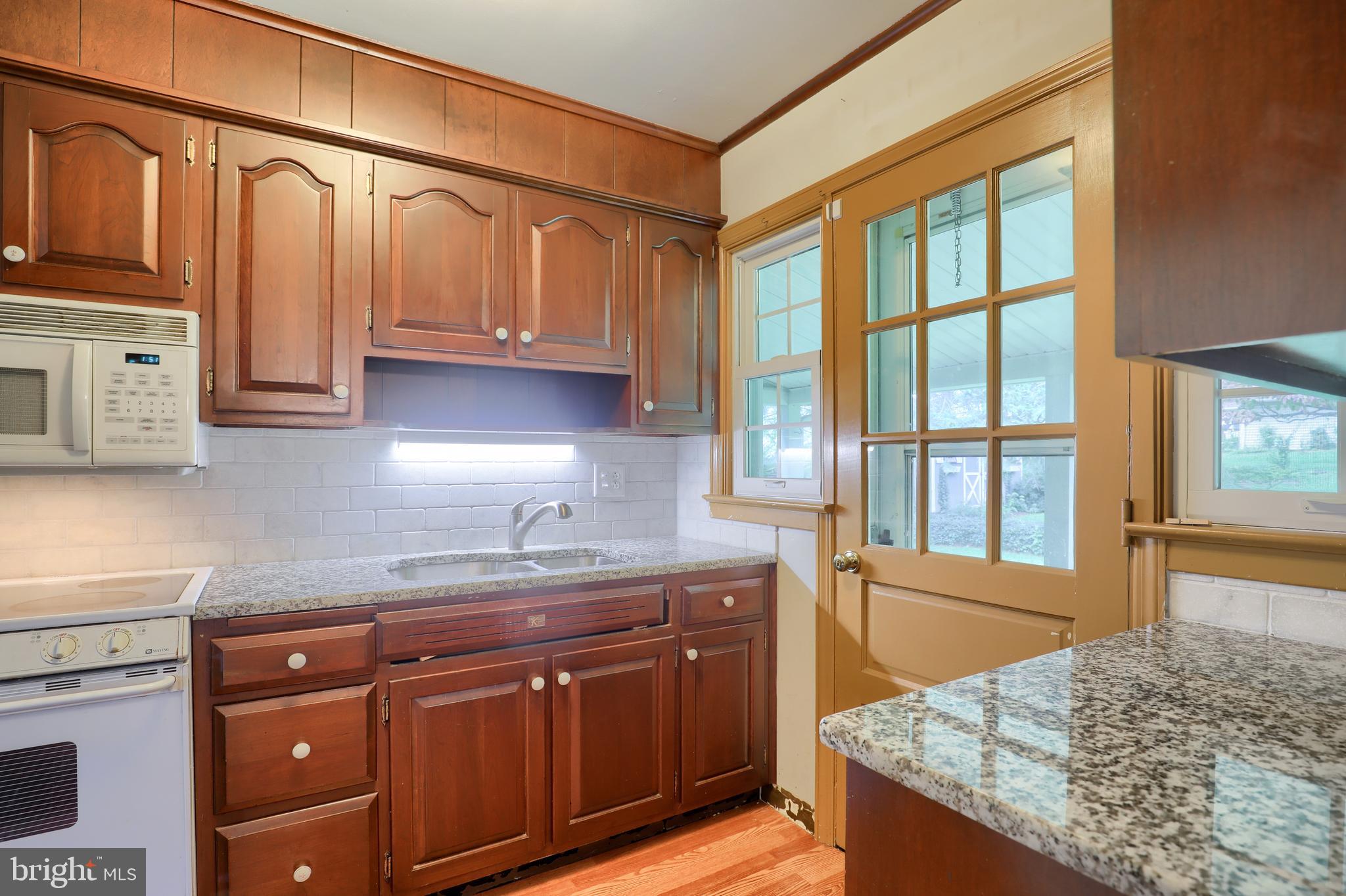 1565 Eden Road Lancaster, PA 17601 - Photo 16 of 33 a kitchen with stainless steel appliances granite countertop a sink stove and cabinets