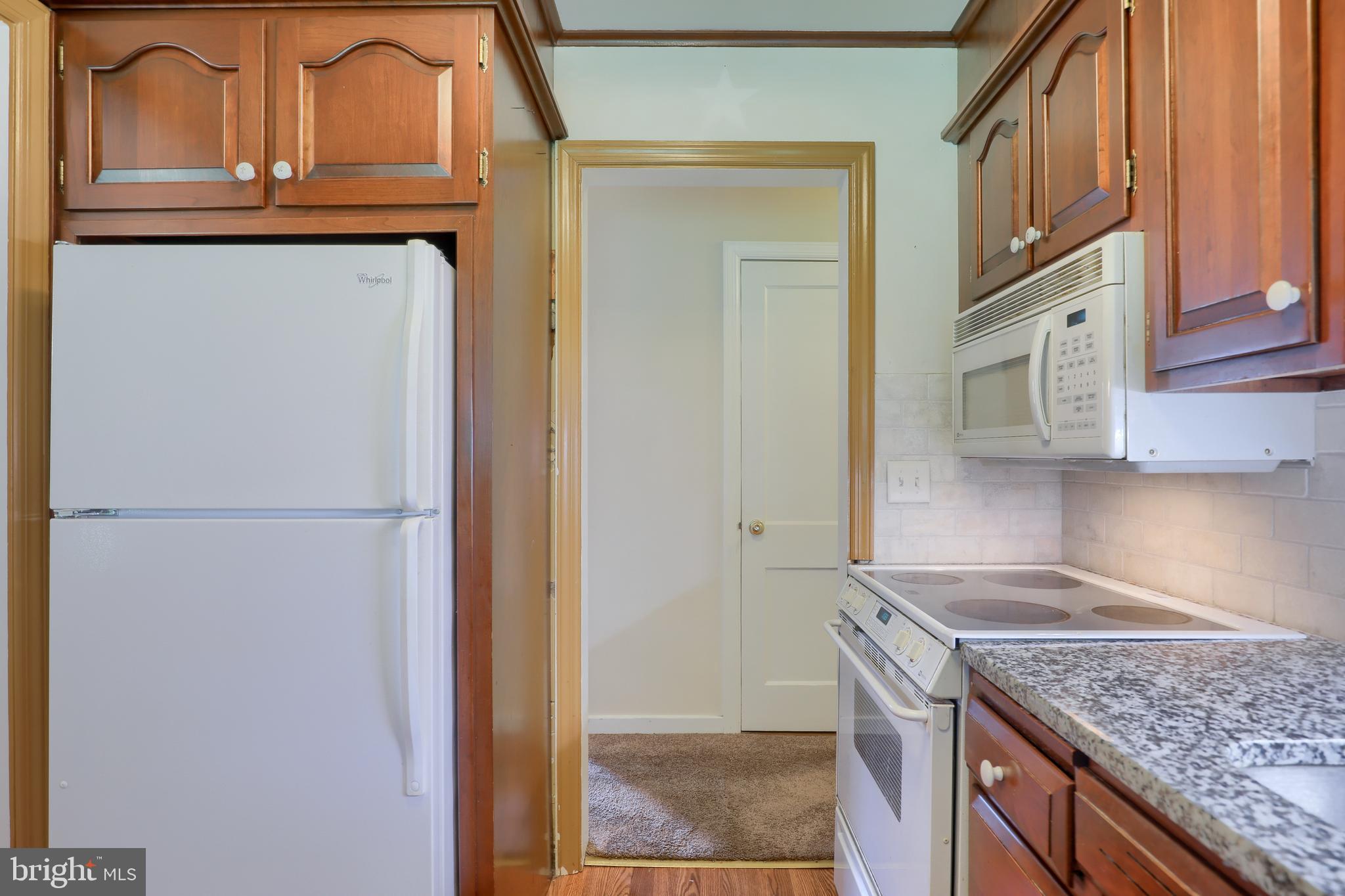 1565 Eden Road Lancaster, PA 17601 - Photo 18 of 33 a kitchen with stainless steel appliances granite countertop a refrigerator and a sink