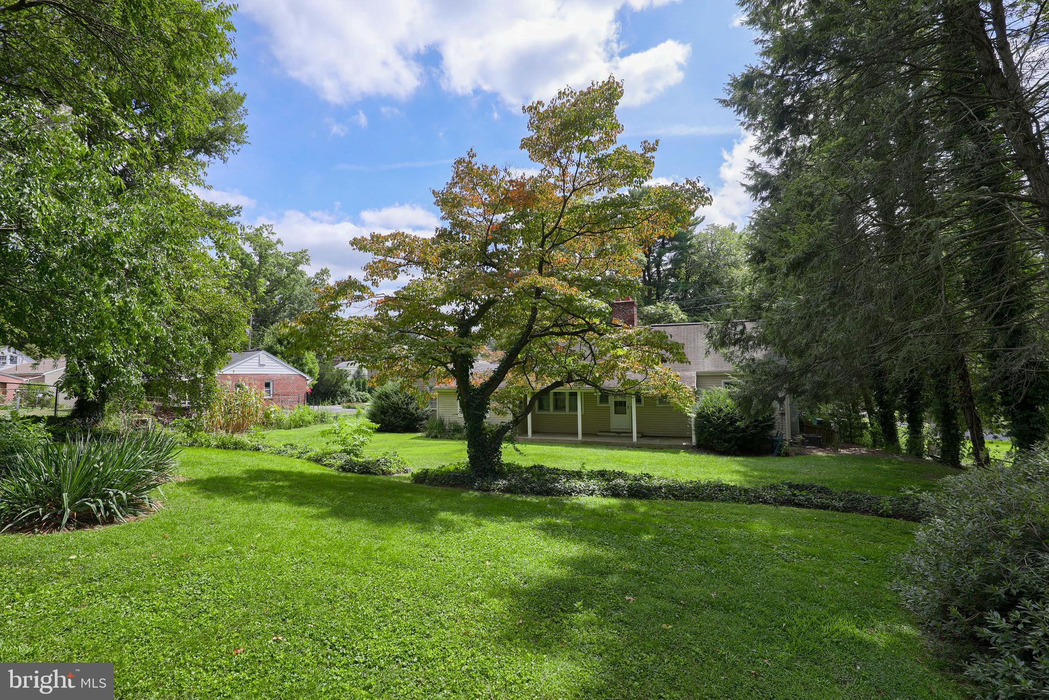 1565 Eden Road Lancaster, PA 17601 - Photo 28 of 33 a backyard of a house with lots of green space and fountain