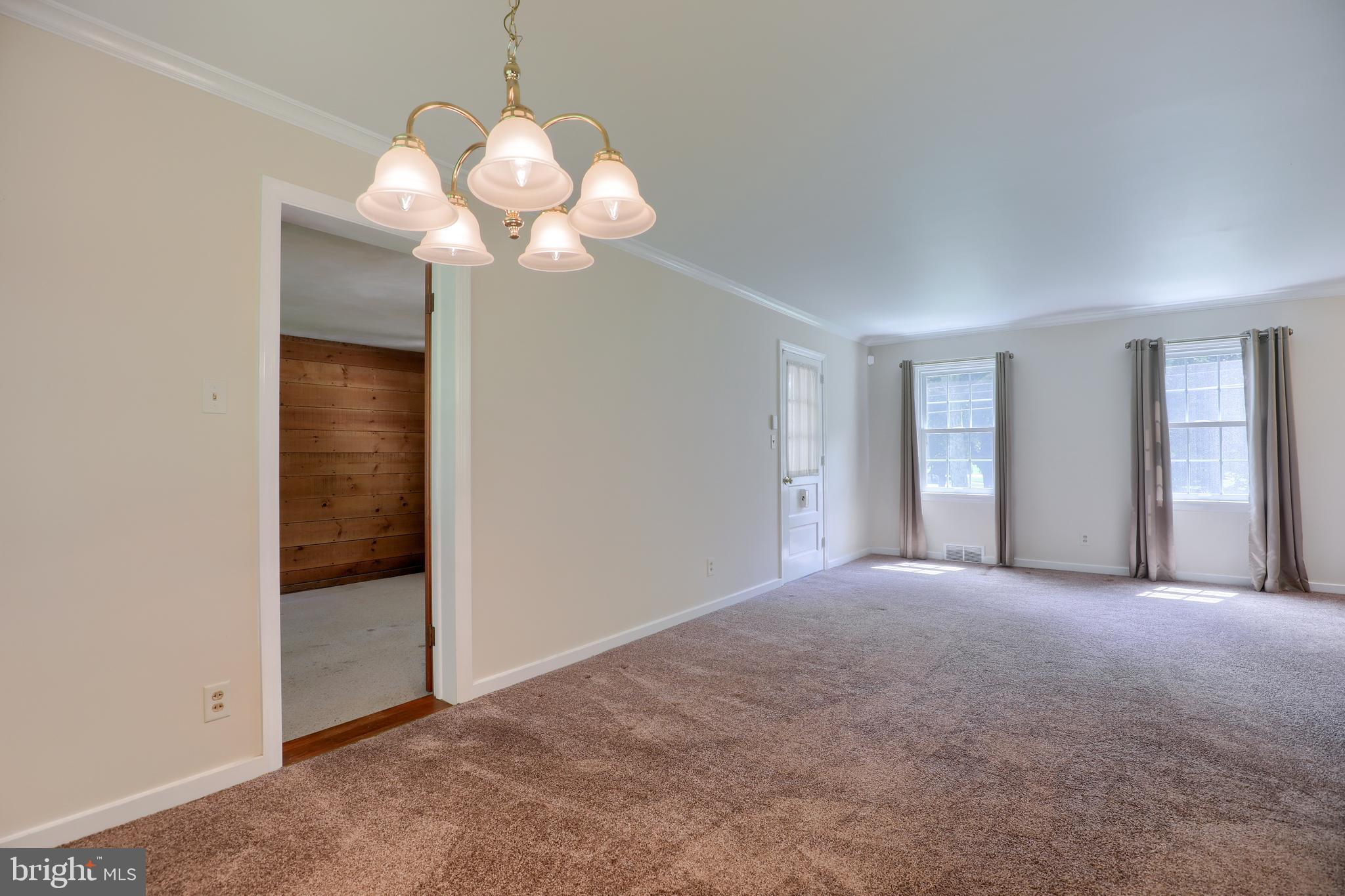 1565 Eden Road Lancaster, PA 17601 - Photo 10 of 33 a view of a chandelier in big room and a bathroom