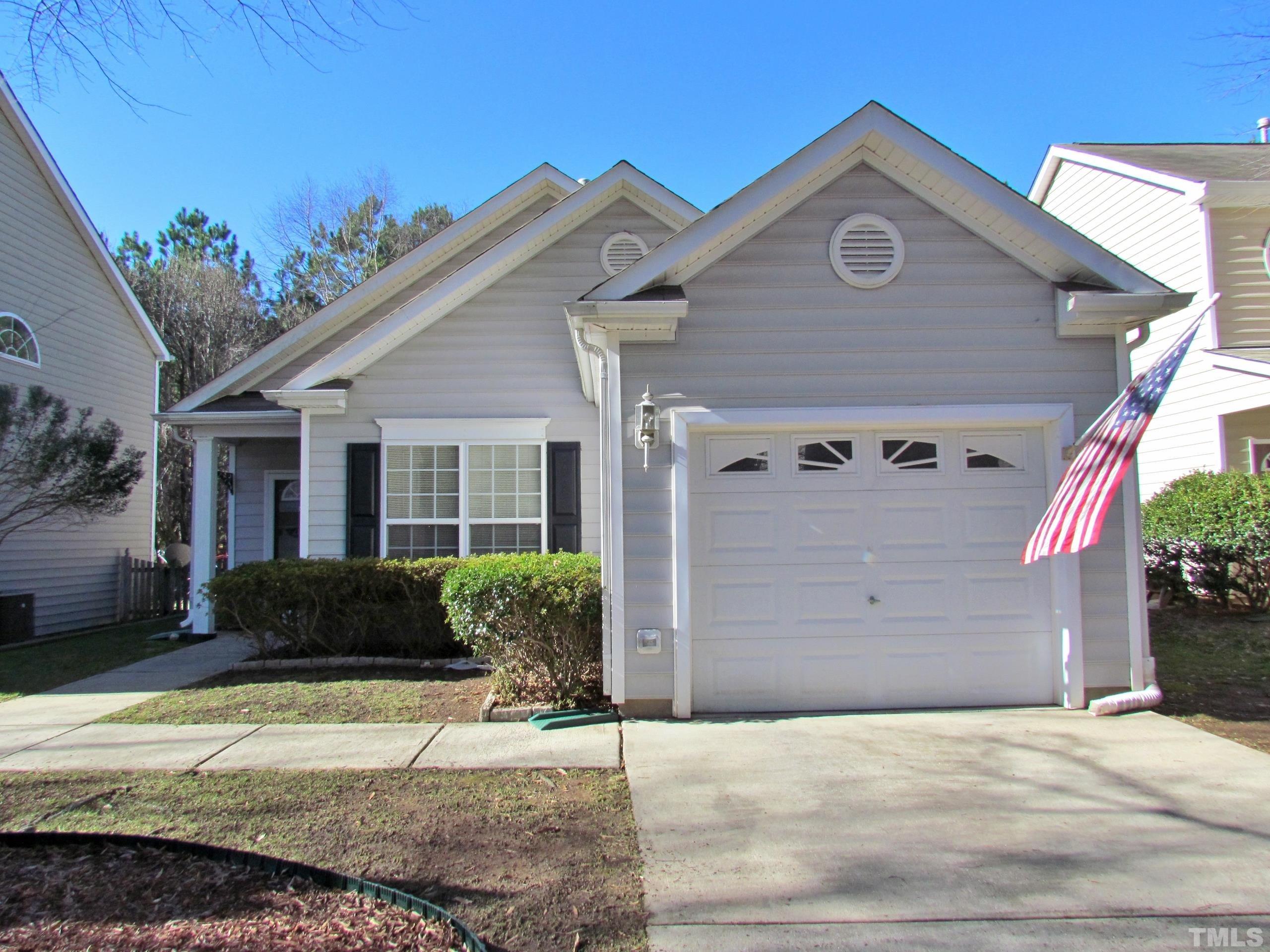 8421 Whisper Ridge Place Raleigh, NC 27613 - Photo 1 of 30 a view of a house with a yard