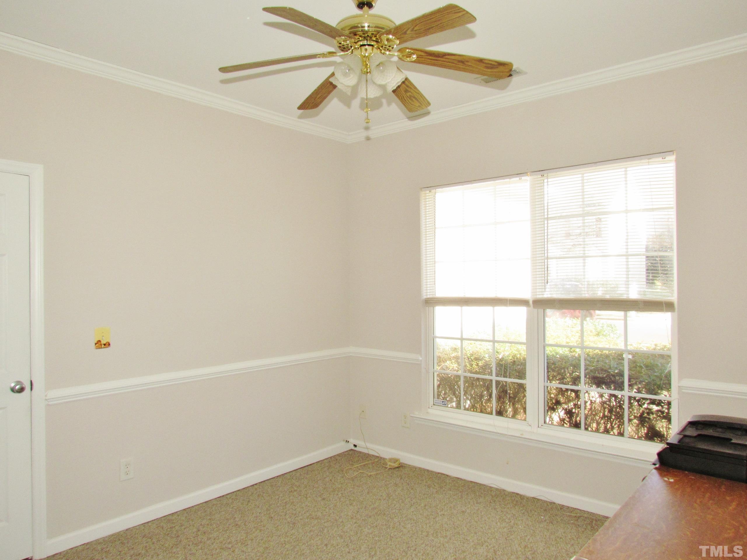 8421 Whisper Ridge Place Raleigh, NC 27613 - Photo 17 of 30 a view of an empty room with a window