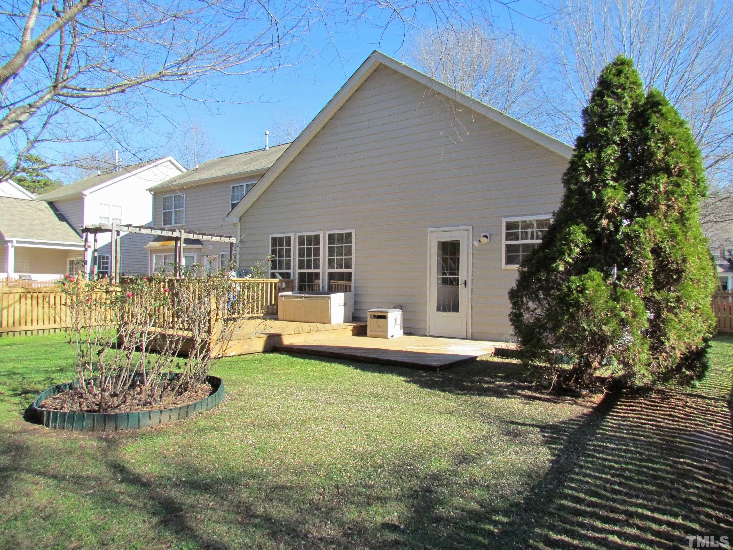 8421 Whisper Ridge Place Raleigh, NC 27613 - Photo 21 of 30 a view of a house with a yard and sitting area
