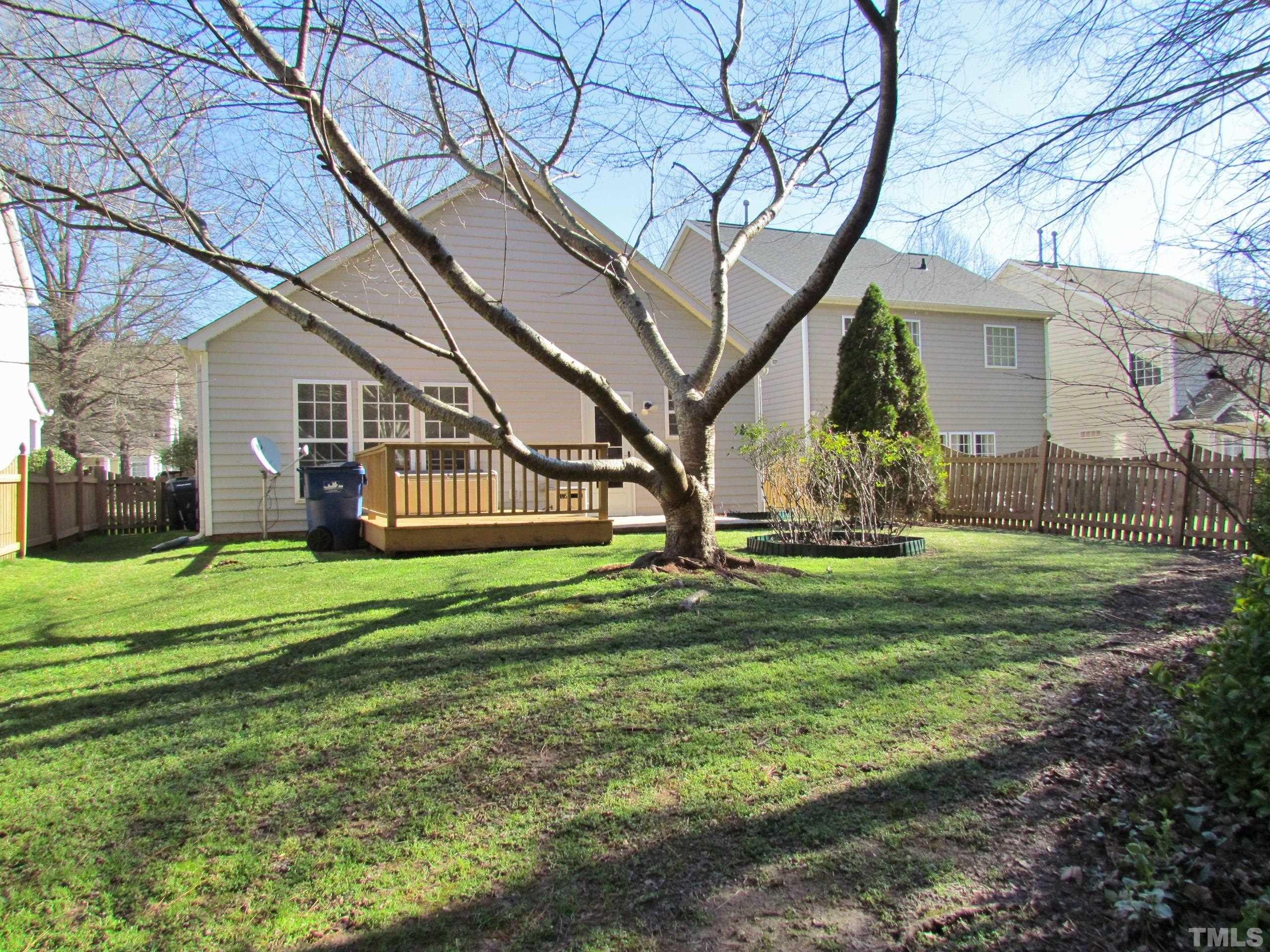 8421 Whisper Ridge Place Raleigh, NC 27613 - Photo 22 of 30 a front view of a house with a garden