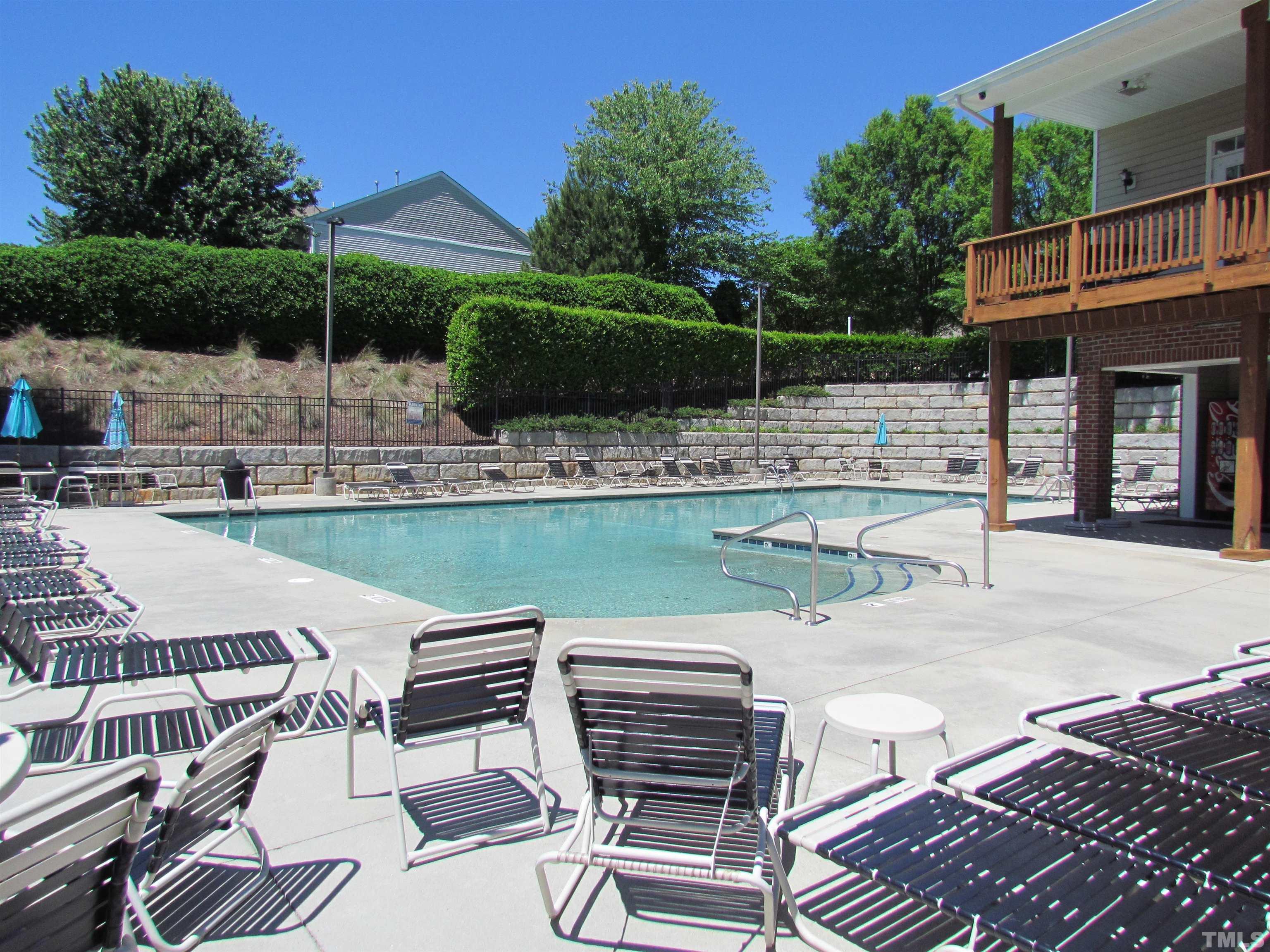 8421 Whisper Ridge Place Raleigh, NC 27613 - Photo 28 of 30 a view of a patio with a table and chairs