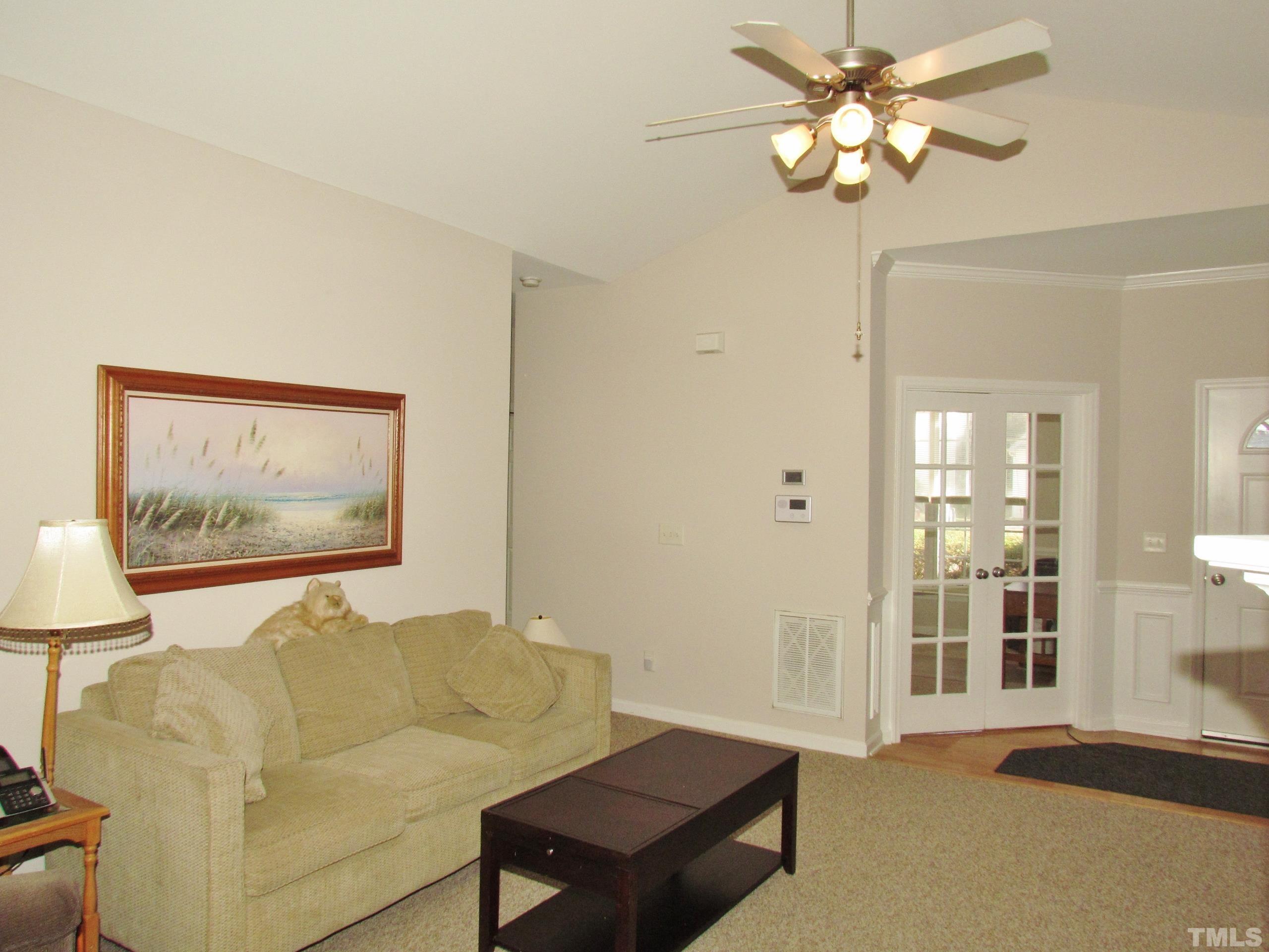 8421 Whisper Ridge Place Raleigh, NC 27613 - Photo 4 of 30 a living room with furniture and a large window