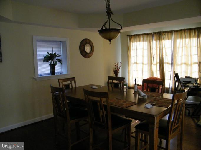 6013 Amherst Avenue Springfield, VA 22150 - Photo 4 of 11 a view of a dining room with furniture and window