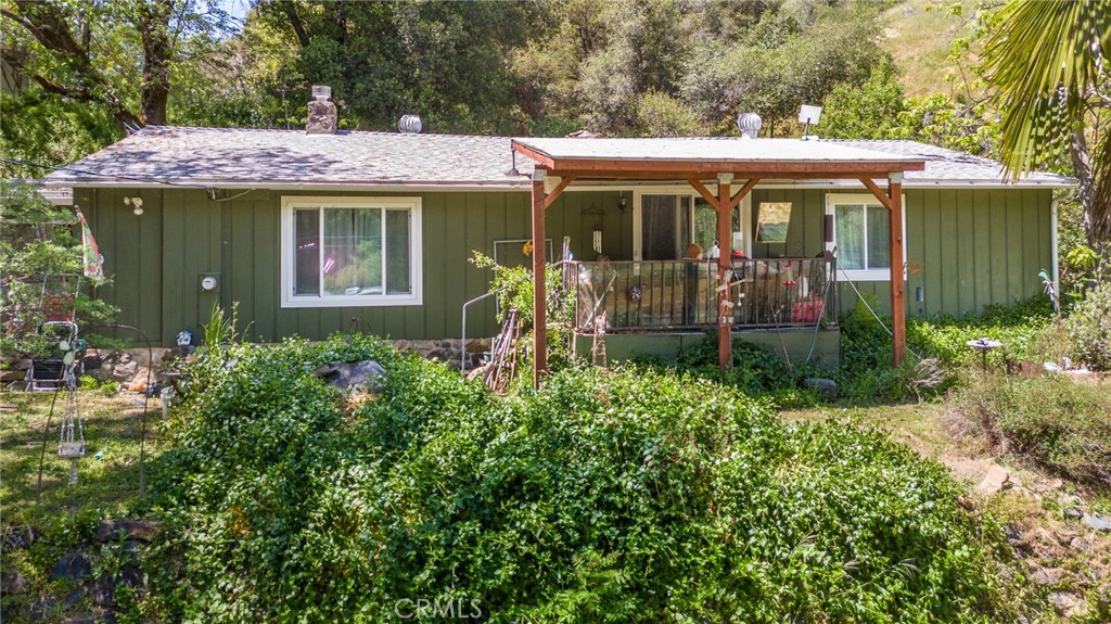 10049 Incline Road El Portal, CA 95318 - Photo 23 of 44 a front view of a house with garden