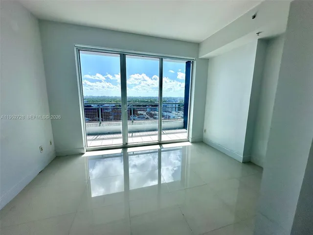 a view of an empty room and window